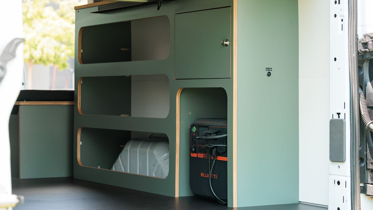 Baltic birch shelving and cabinetry inside a camper van