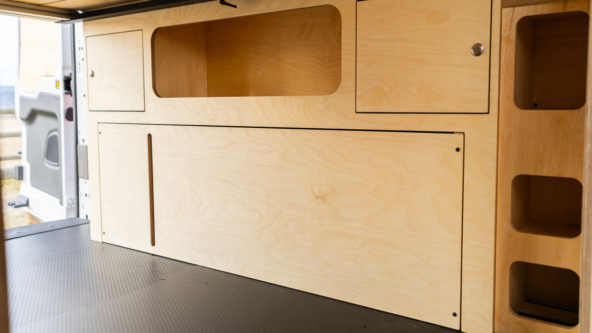 Baltic birch lower storage cabinets in a camper van