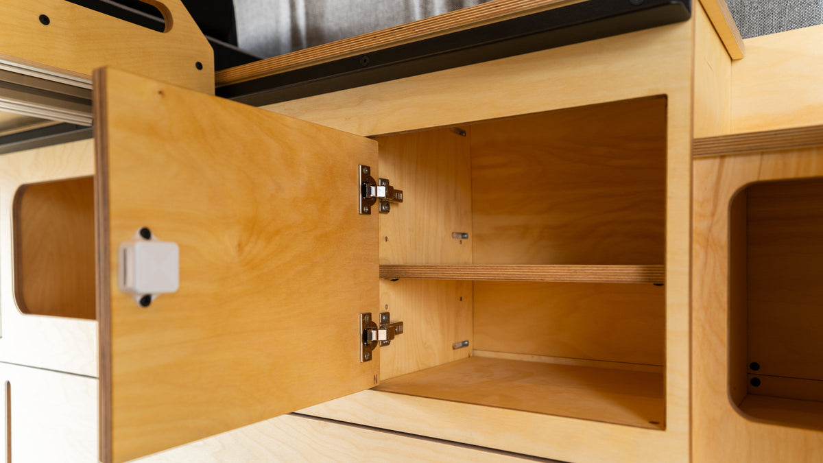 Baltic birch cabinetry installed in a camper van