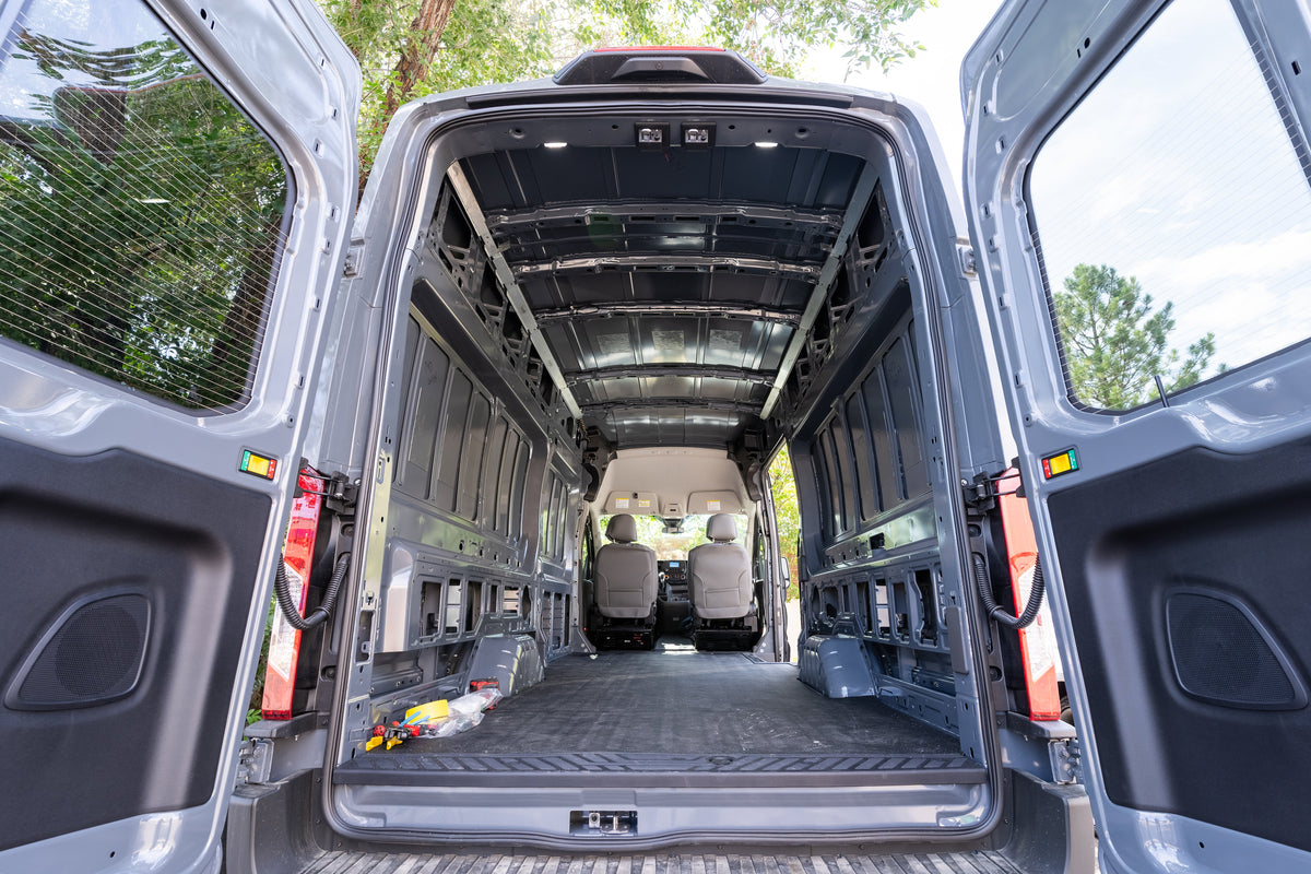 Empty Ford Transit cargo van interior before a camper conversion begins