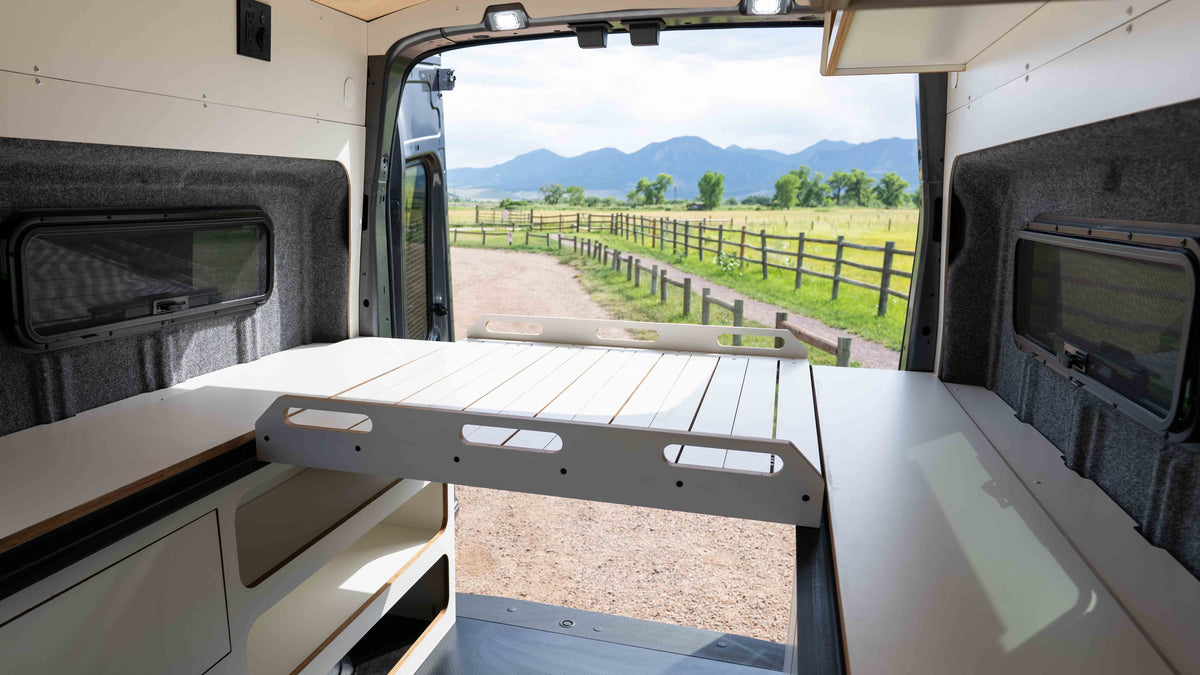 CR Laurence window installed in a camper van looking out to a road